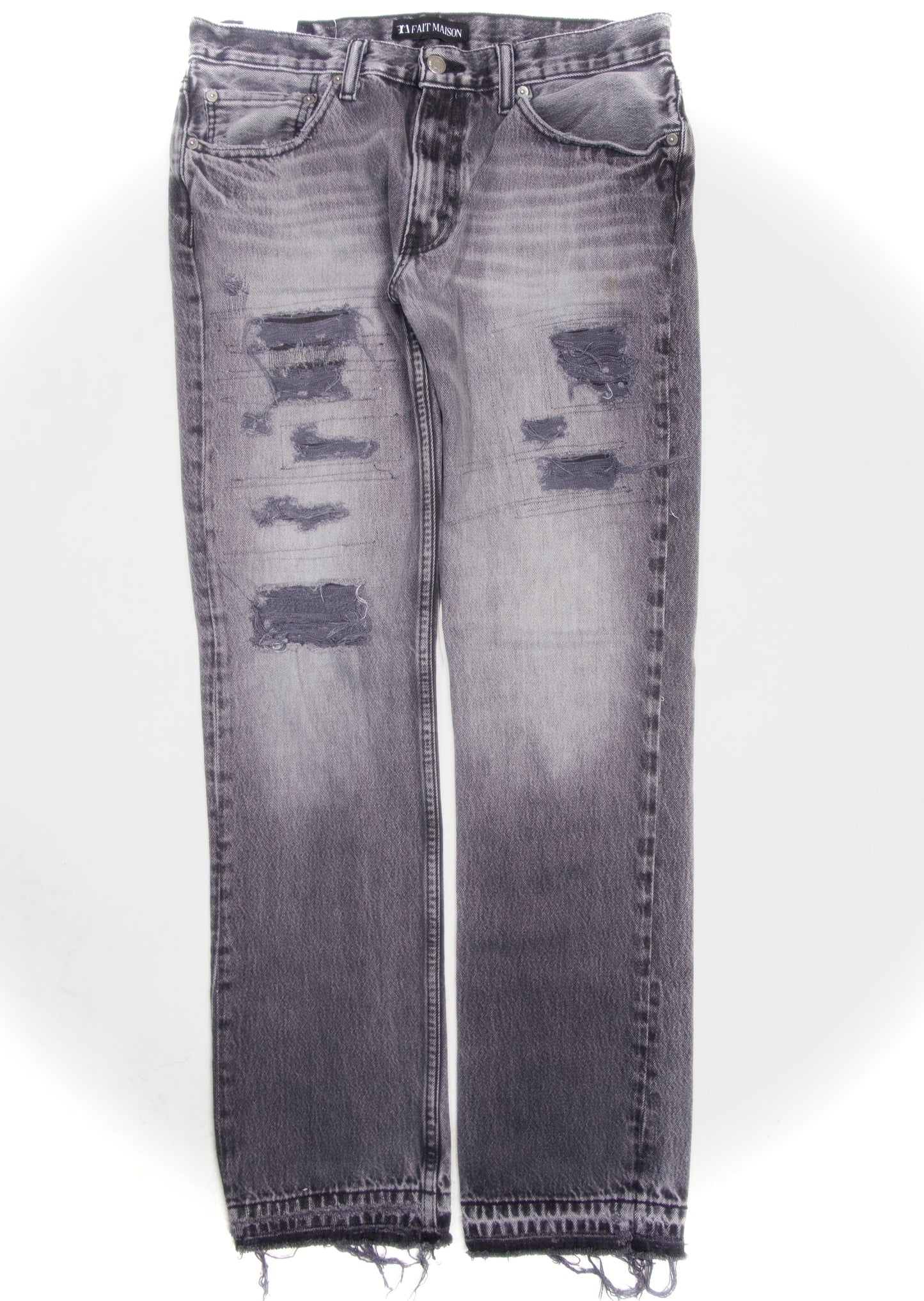 Grey distressed and repaired denim